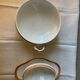Deux plats en porcelaine rose saumonée et liseré or circa 1900