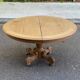 Round dining table with a central pedestal, stripped raw oak, 4 extensions, 19th century.