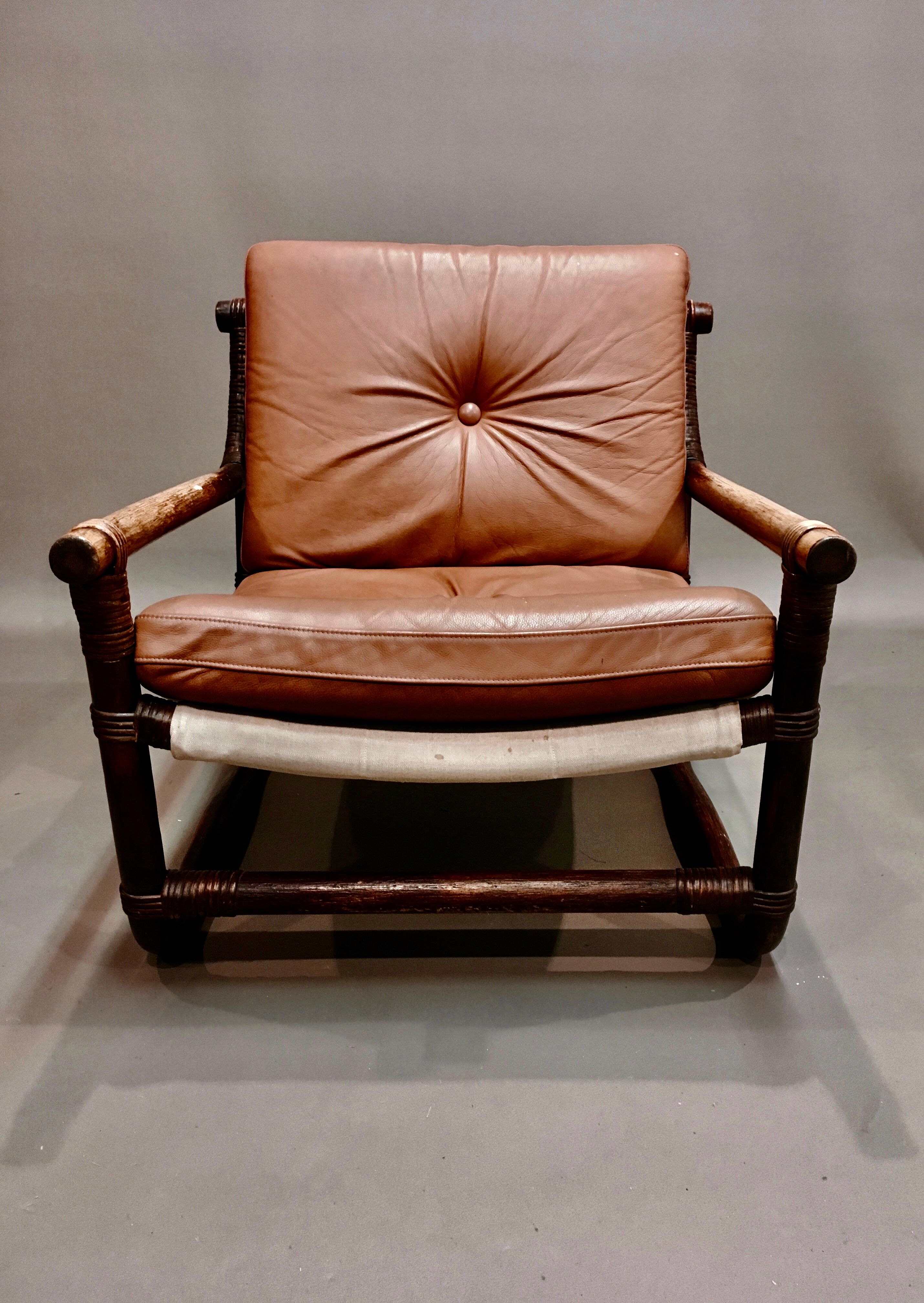 Fauteuil et son ottoman rotin et cuir 1950
