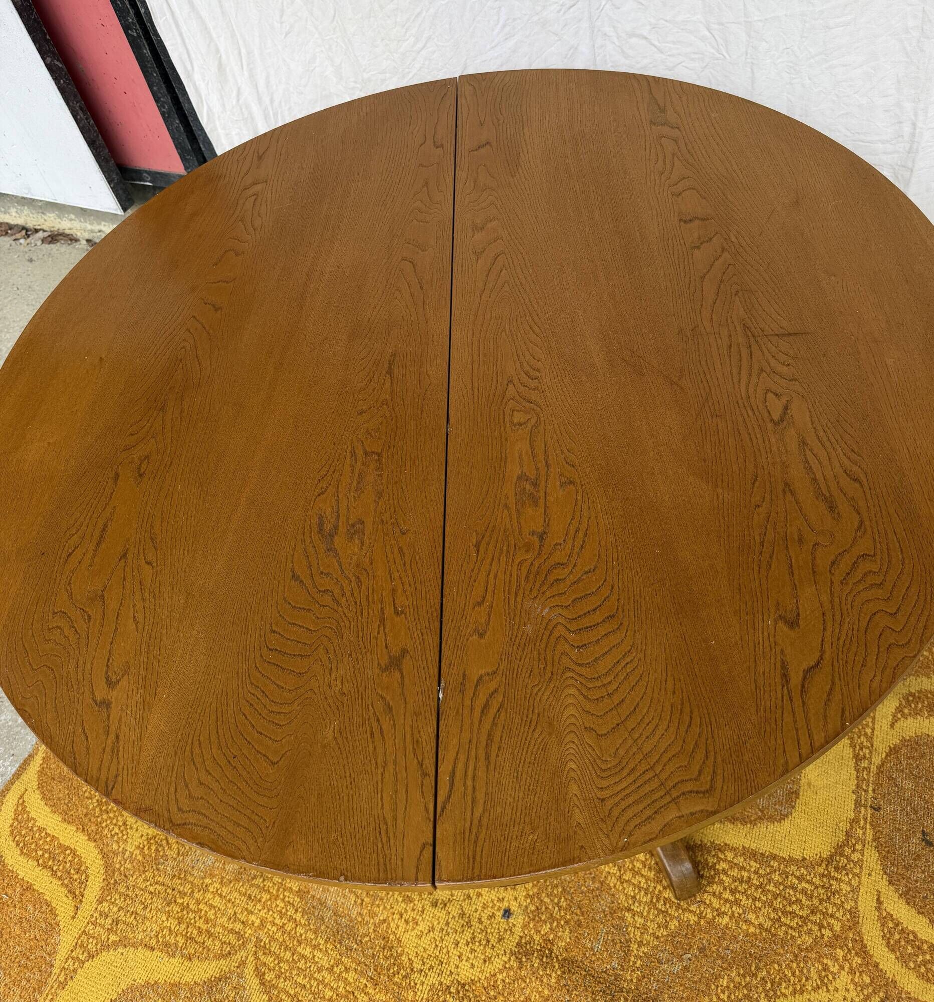 Round table with central base from the 1960s by Baumann.