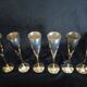 Lot of 12 silver metal flutes on brass stand