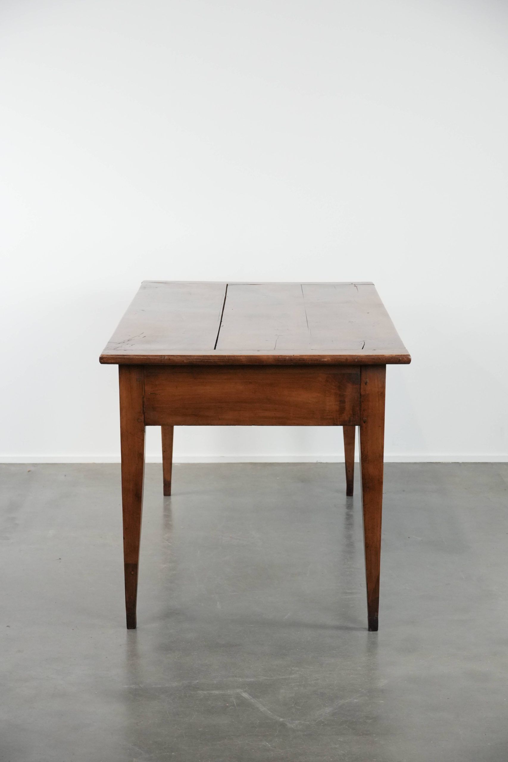 Elegant and subtle antique French dining table made of fruitwood