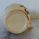 Old pitcher, pot to ance, faience, floral decoration.