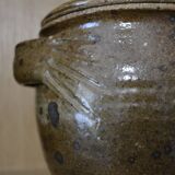 Sandstone pot with handles hands