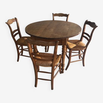 Table ronde en bois (4/6 personnes) avec 4 chaises paillés