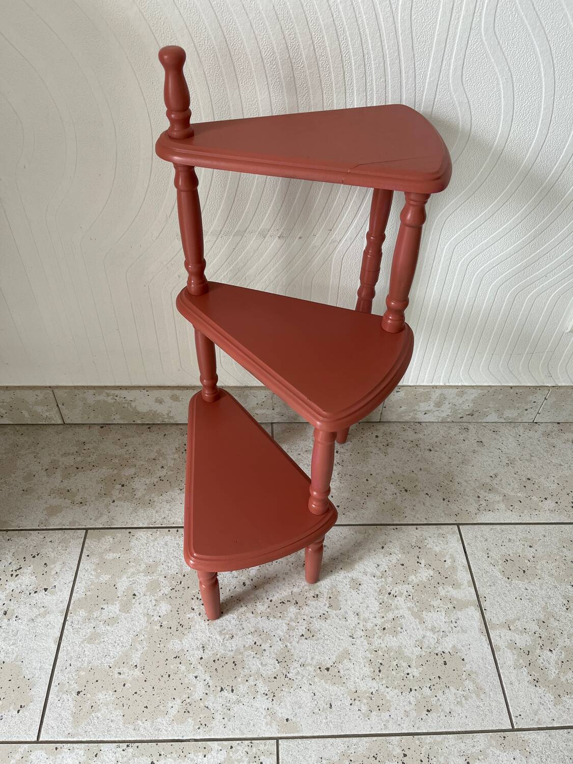 Old plant holder repainted in terracotta