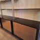 Wall shelves in wood, stainless steel and glass Roche Bobois
