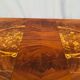Louis XVI style oval dining table with rosewood marquetry extension mounted in bronze