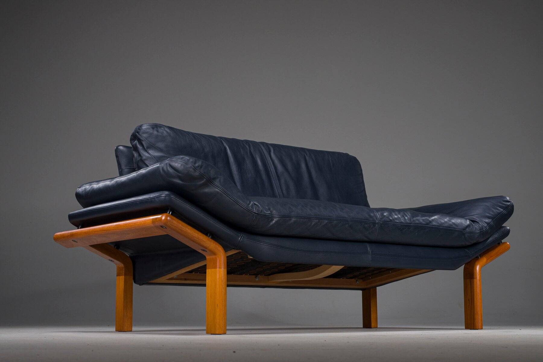 Danish teak and navy blue leather 2-seater sofa from Komfort, 1970s