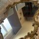 Antique mirror in Louis XV Rocaille style with carved frame.
