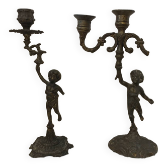 Pair of Cherub candlesticks.