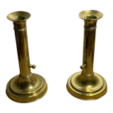 Duo de bougeoirs poussoir en laiton