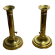 Duo of brass push candle holders