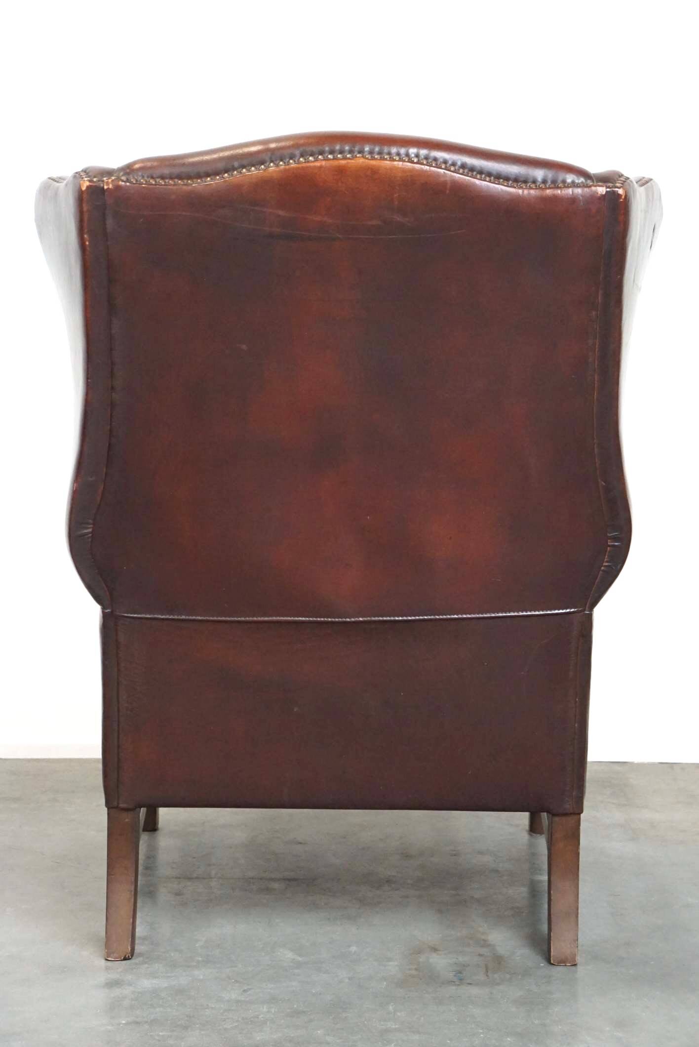 Beautiful classic and stately wingback armchair made of sheep leather with beautiful colors