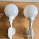 Antique enamelled cast iron wall lights / opaline globe