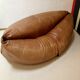 Two-seater leather pouf sofa by Raphaël Raffel for Honoré Paris