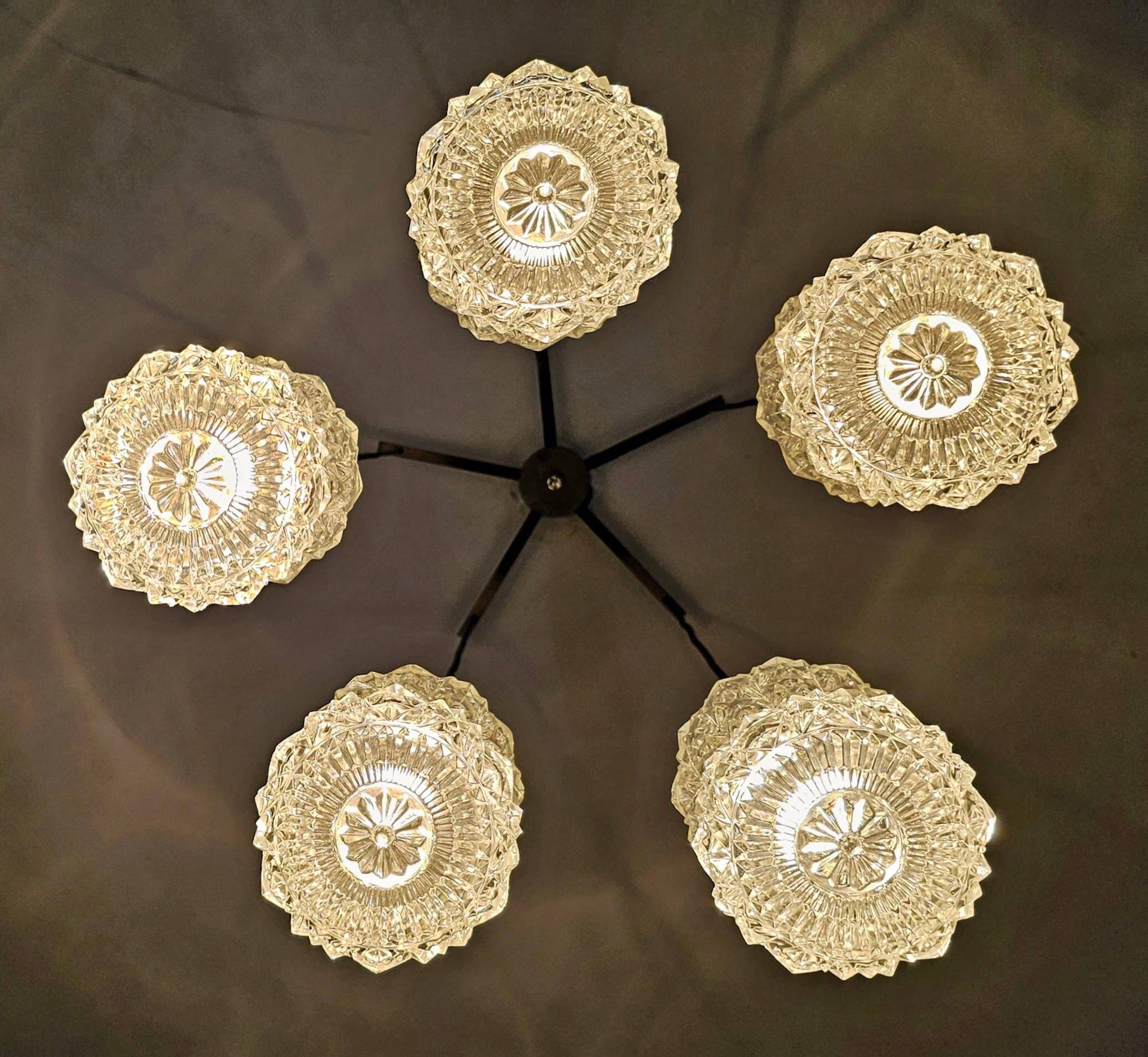 Mid Century Modern spider chandelier in teak, rosewood, and crystal.