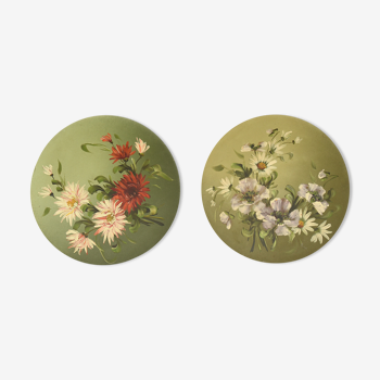 Pair of round plates painted with flower decoration