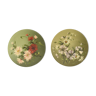 Pair of round plates painted with flower decoration