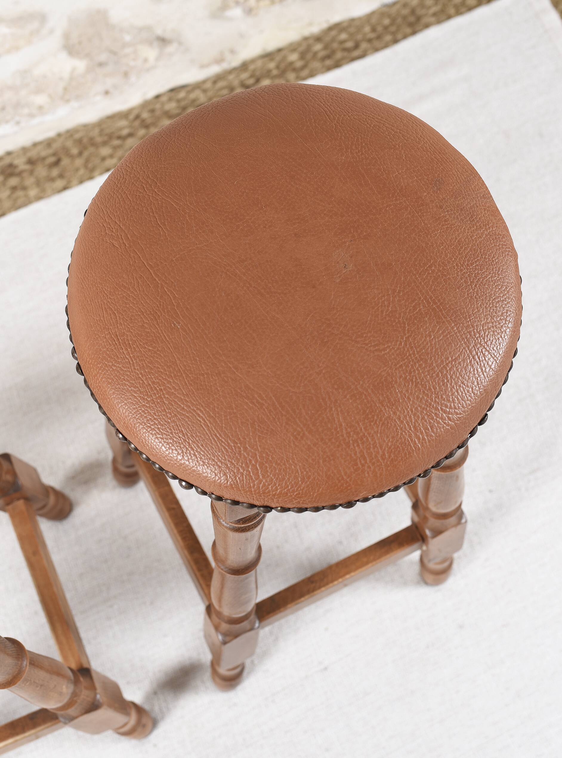 Antique bar stools, brown leather and wood