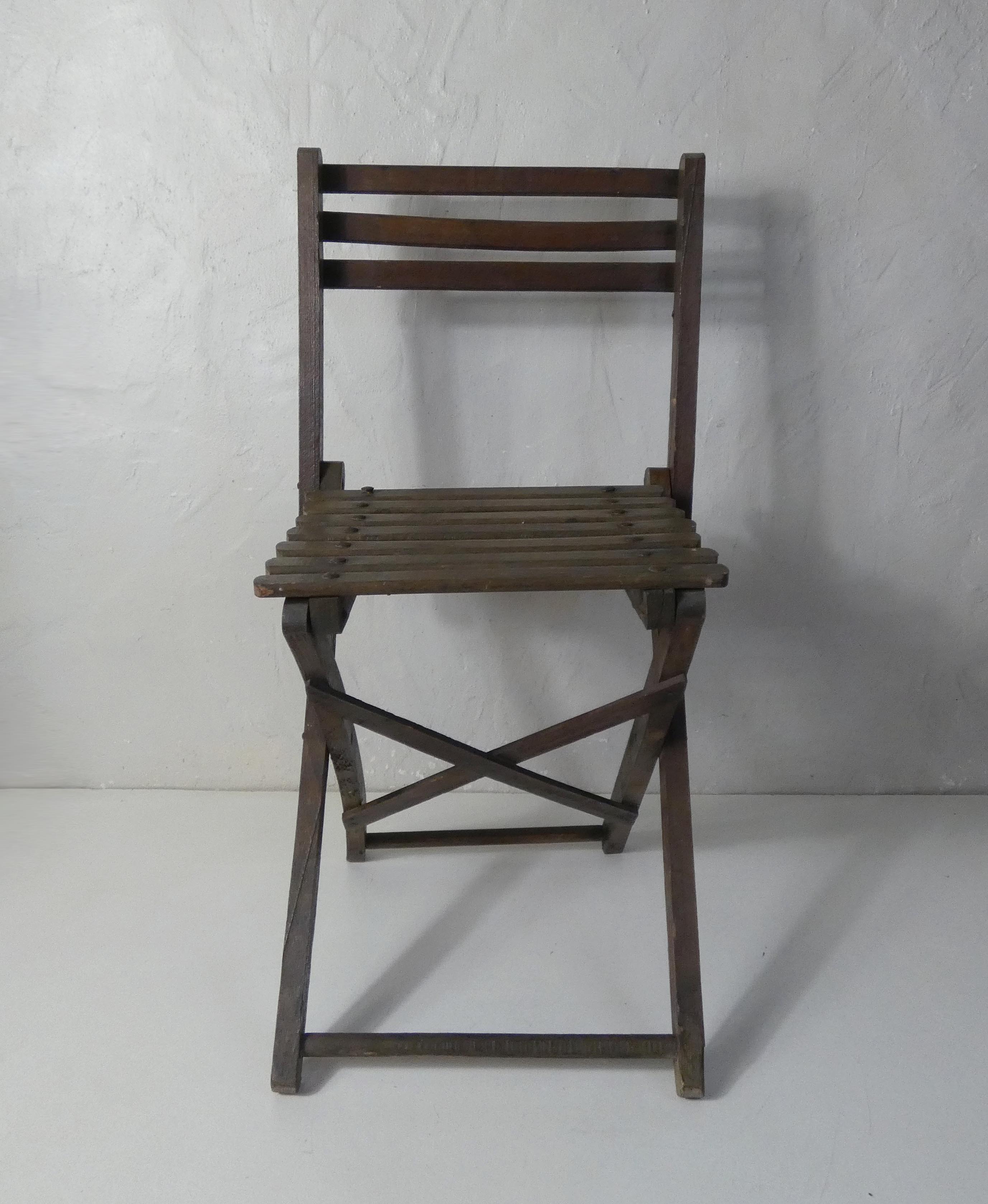 Old folding wooden chair for children