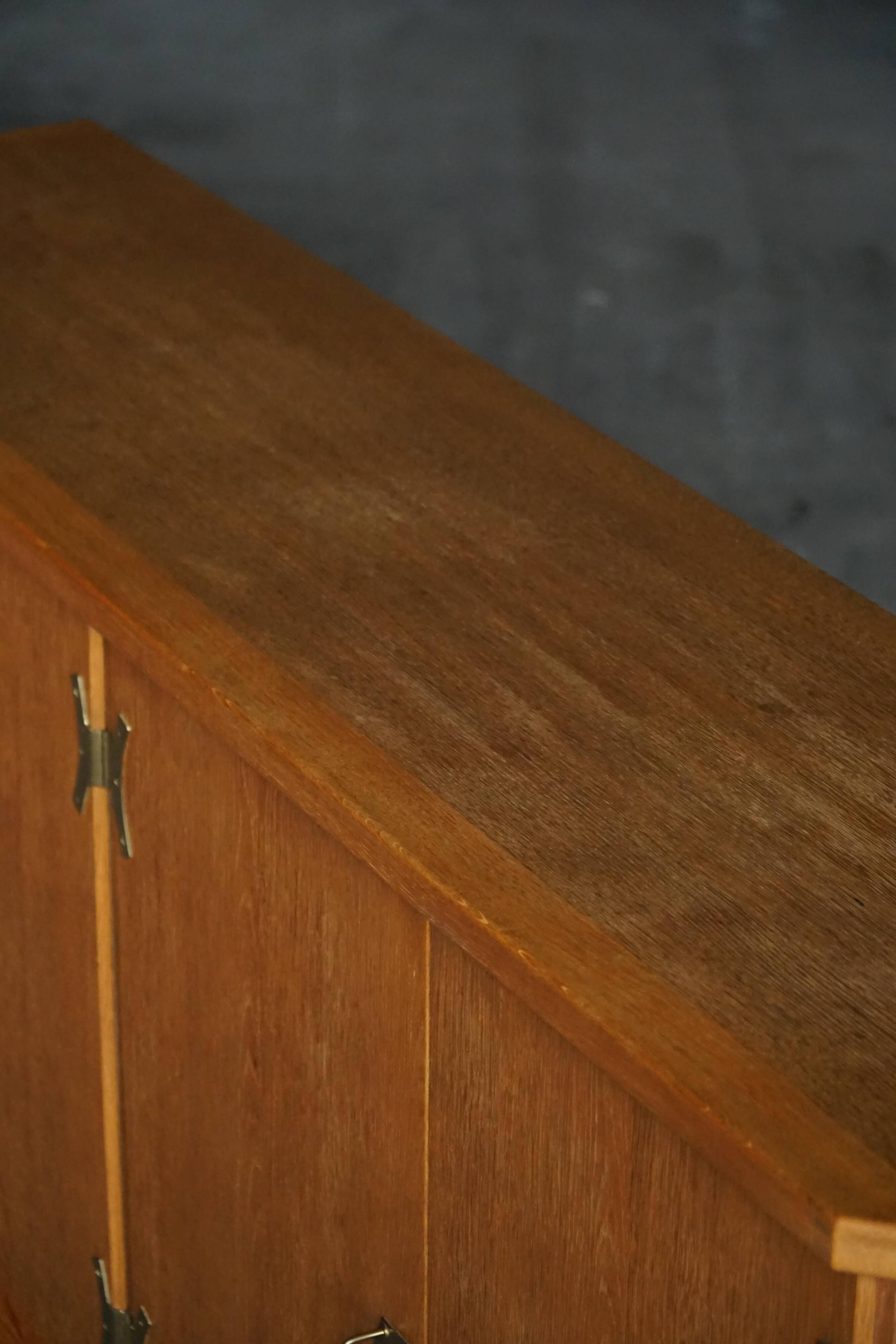 Oak and brass buffet by Henning Kjærnulf, Mid-century modern Danish, 1960s.