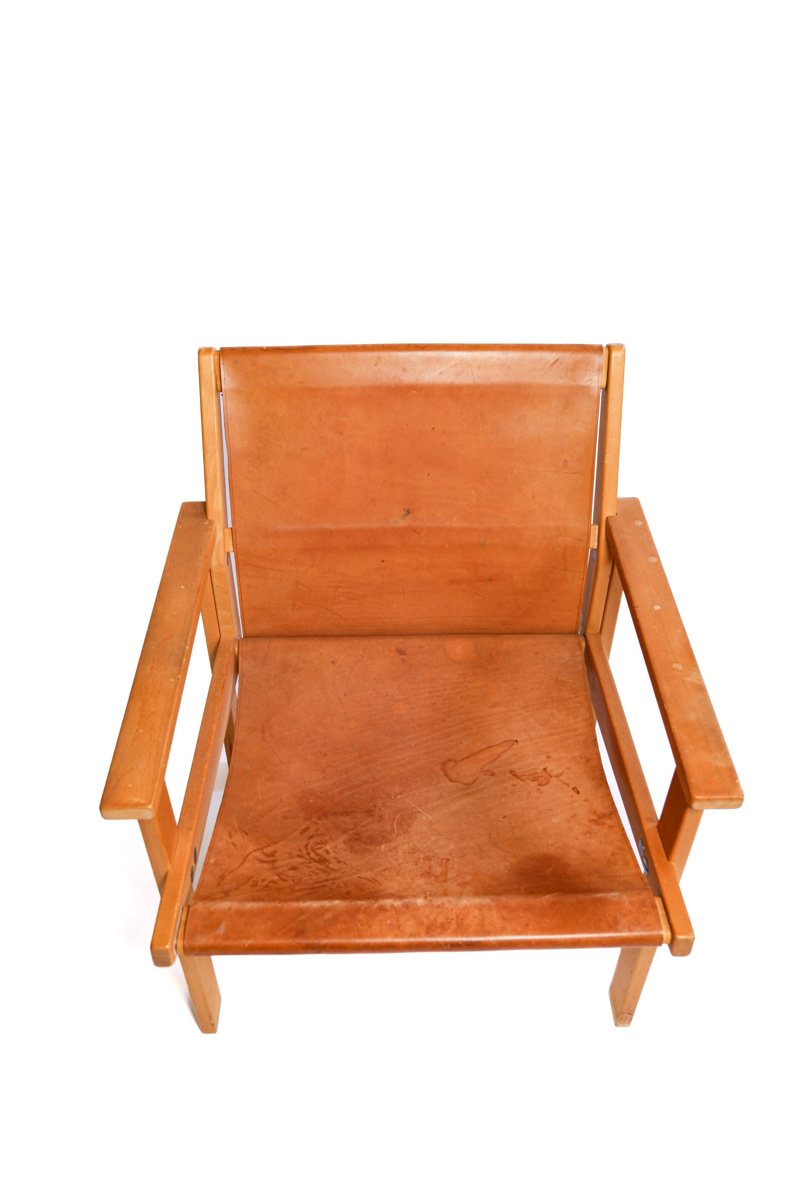Rare Hans Agne Jakobsson armchair in leather and wood. Circa 1970