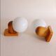 Pair of wall lights in pine and opaline, 1960s.