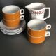 Hot chocolate cups and milk jar