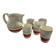 Red, white and silver porcelain jug set by Edmond Bellefroid for Robo.