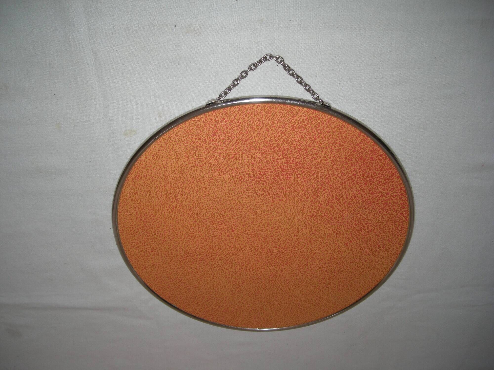 Round barber mirror with chain from the 1950s.
