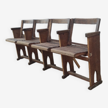 Row of 4 vintage cinema armchair seats in weathered wood