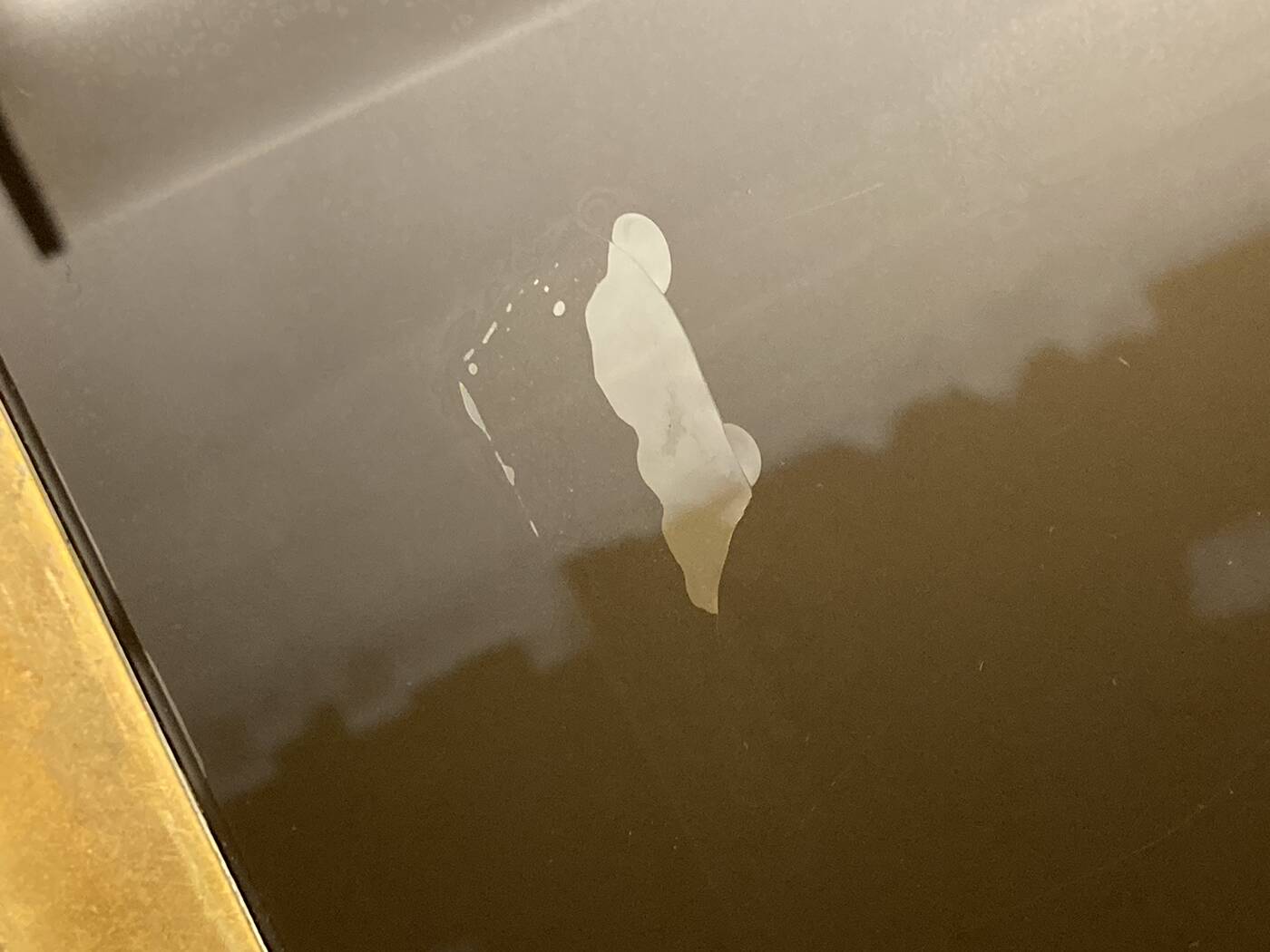 Coffee table in solid brass and black opaline. 1970