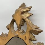 Wooden mirror with gilded stucco