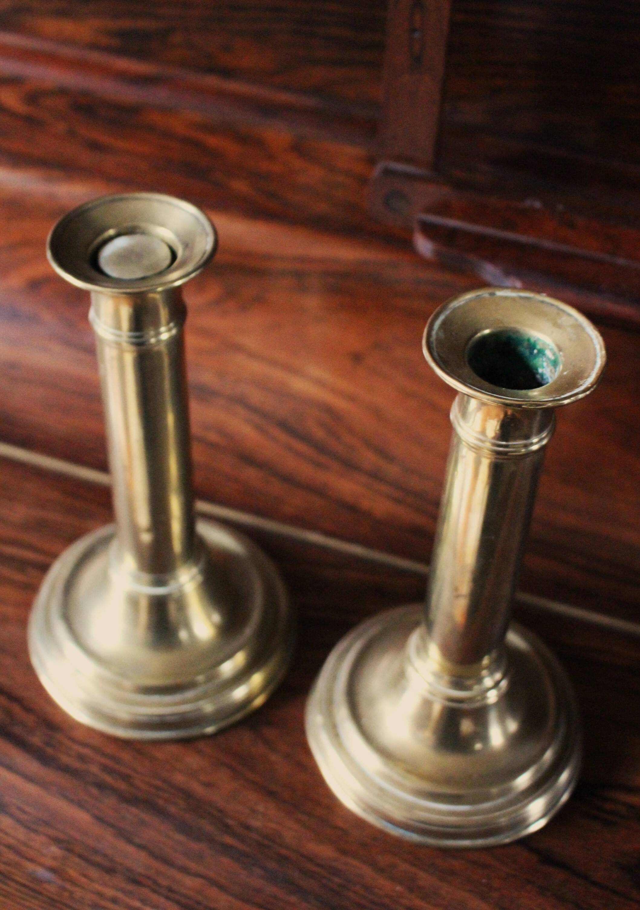 Pair of brass push-button candlesticks