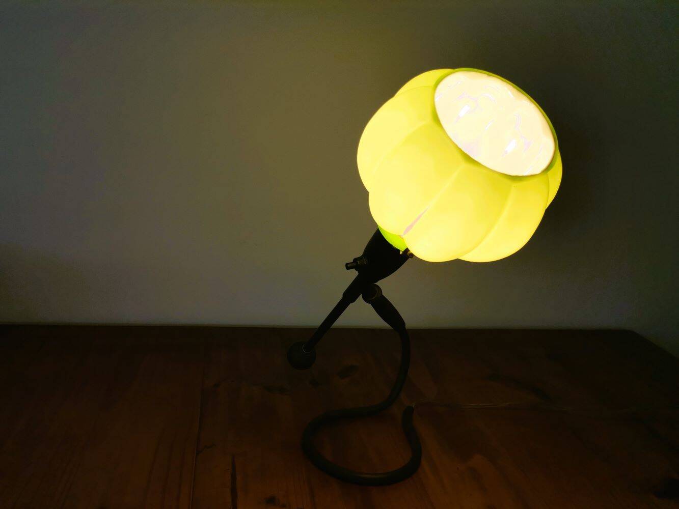 Modernist green cased glass and brass articulated table lamp