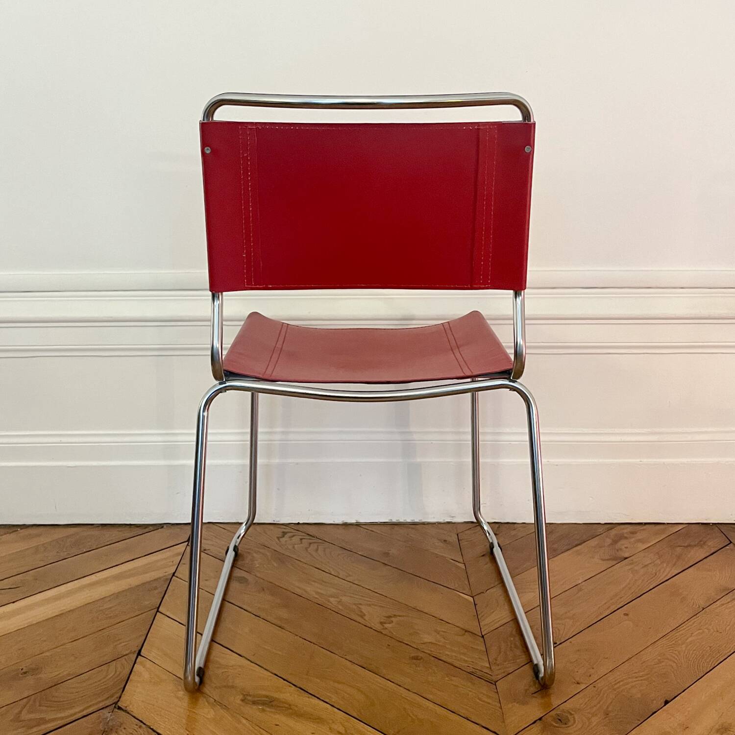 Set of 4 chairs in red leather and chrome tubular metal