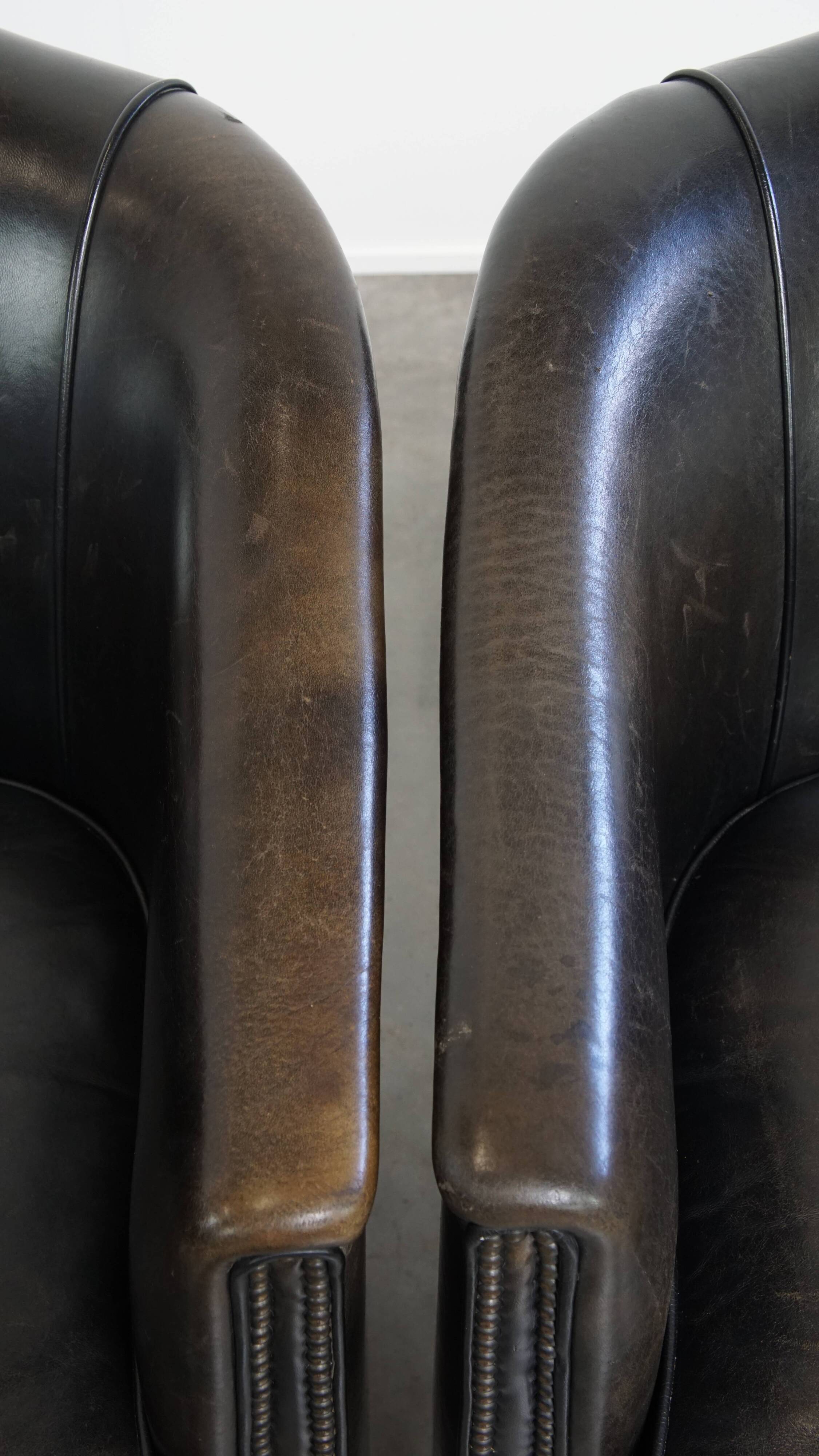 Set of 2  black/grey sheepskin leather club chairs