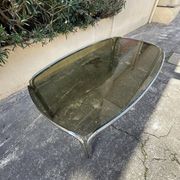Vintage curved rectangular dining table in smoked glass and metal.
