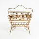 Extraordinary mid-century newspaper and magazine rack with a gilded metal