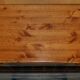 Vintage wooden furniture for 45 wine bottles with a drawer.