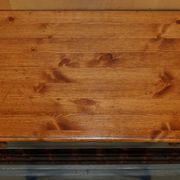 Vintage wooden furniture for 45 wine bottles with a drawer.