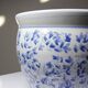 Vintage Chinese cache-pot in blue and white porcelain with a floral design.
