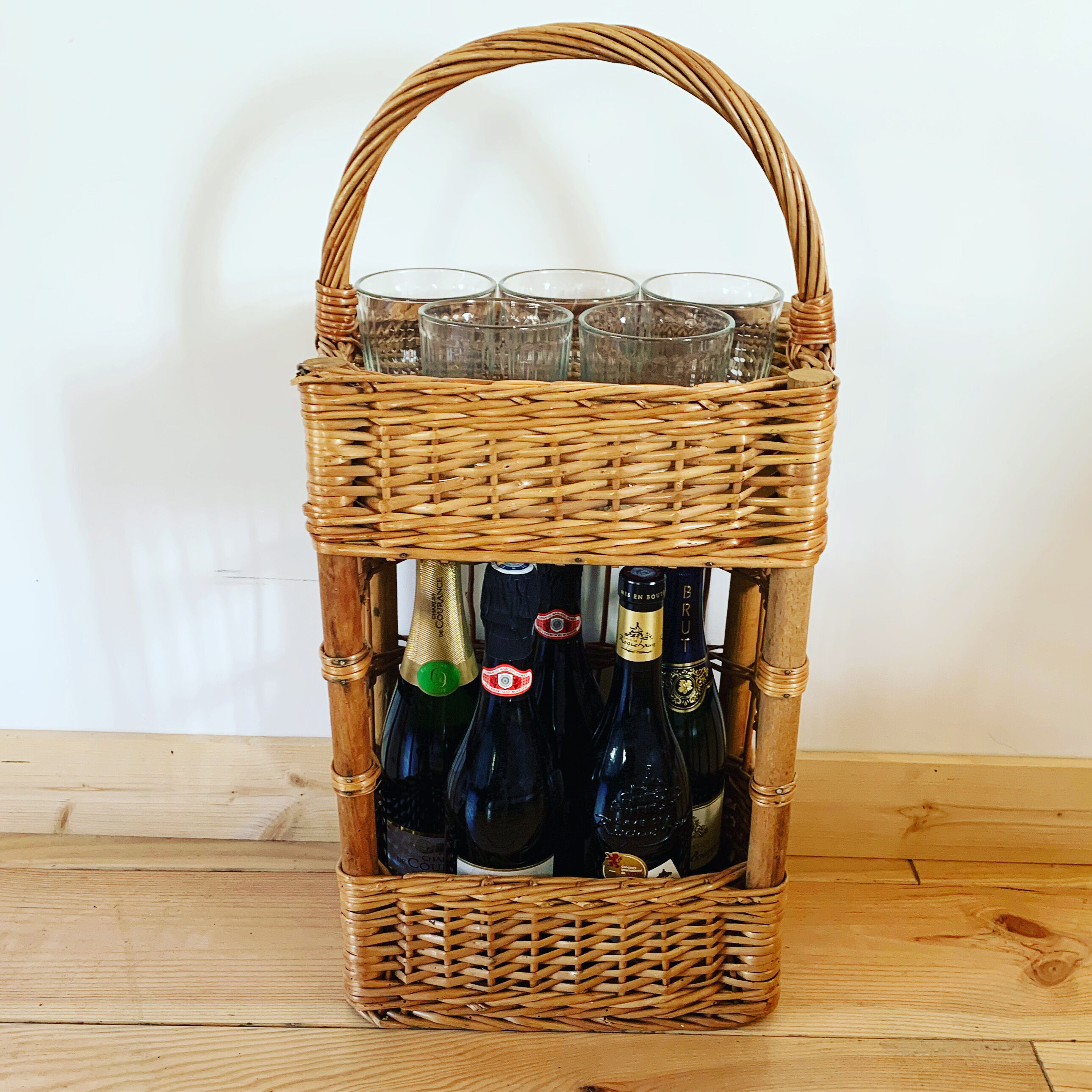 Vintage wicker bottle bar