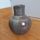 Enamelled stoneware vase signed