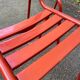2 red metal Tolix-style chairs, France 1950