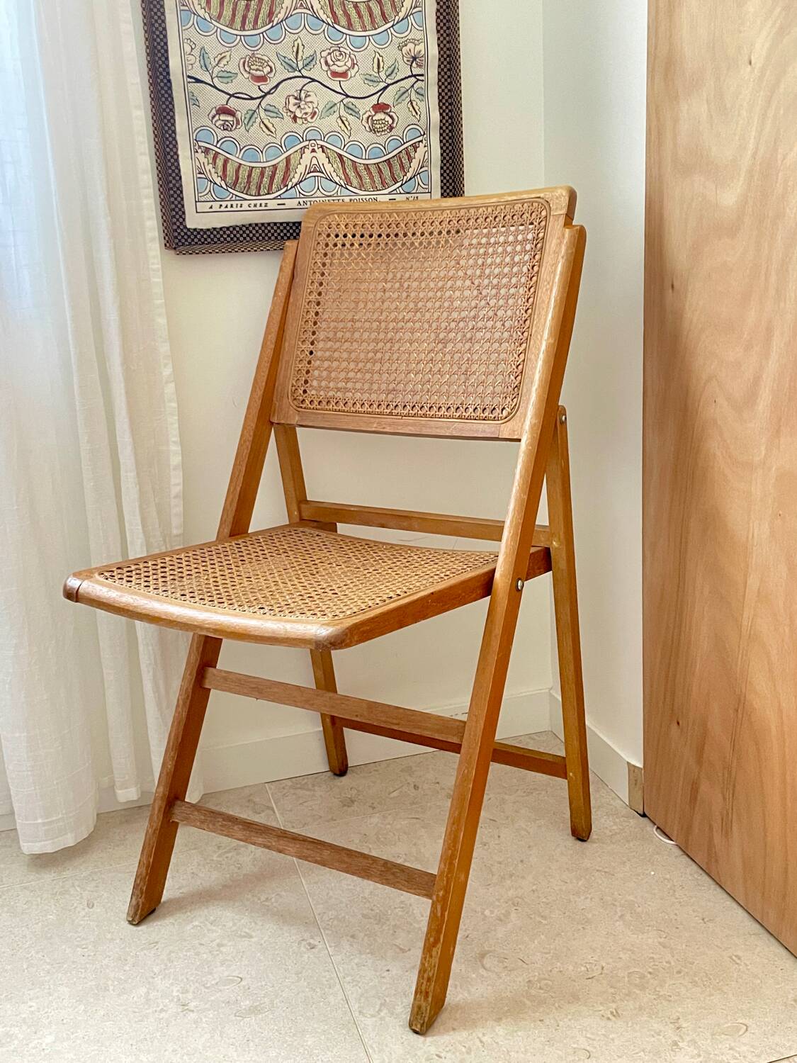 Folding wooden and cane chair