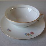 Old large tea cup and saucer in Limoges porcelain with flower decor