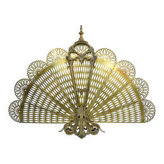 Old fan-shaped chimney fire screen. Gilt bronze. 19th century