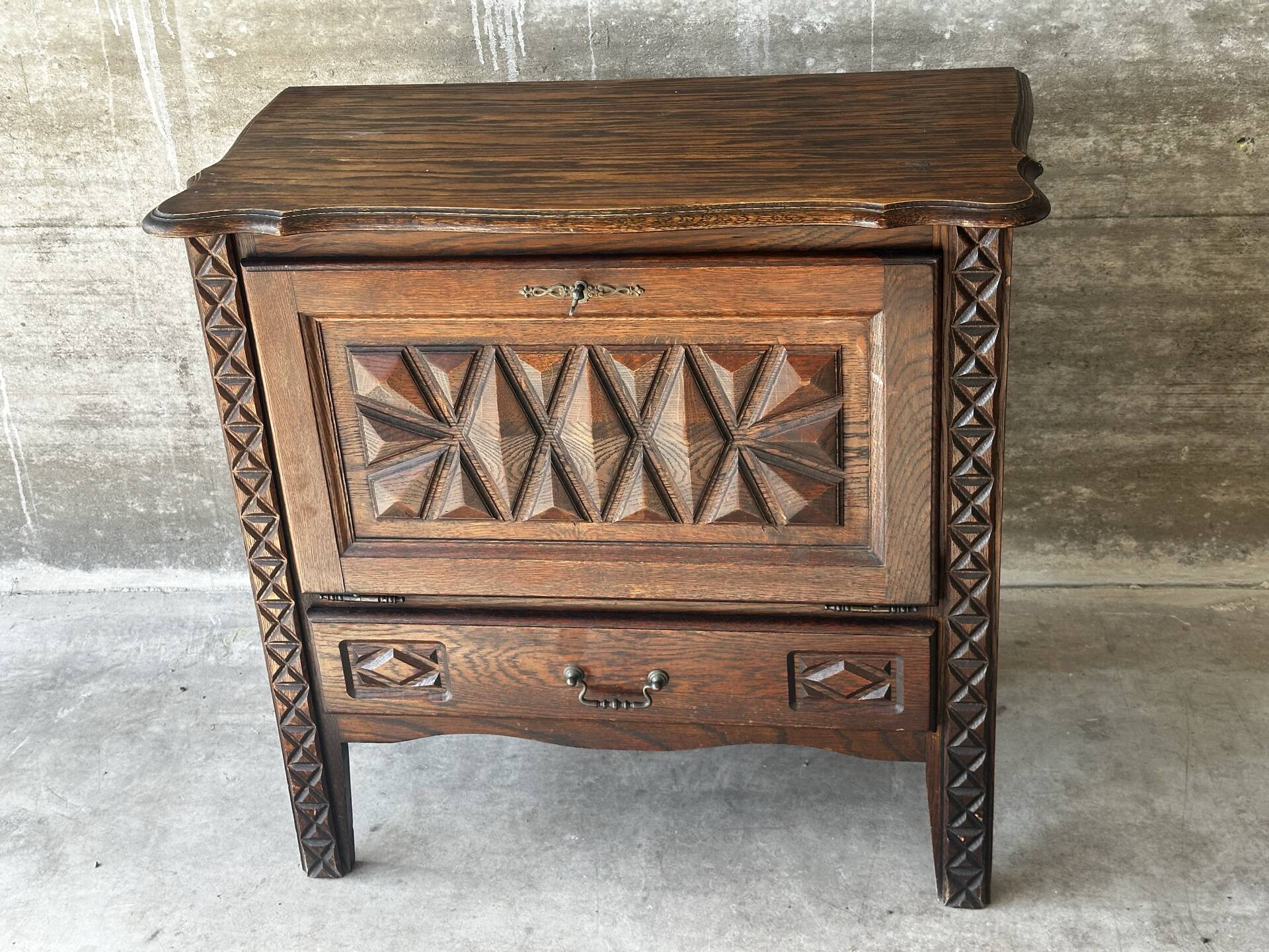 Small storage cabinet in carved oak – circa 1930